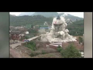 Demolition squad blow up a bridge and a tower at the same time in China